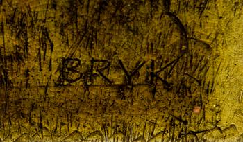 A ceramic relief, signed Bryk.