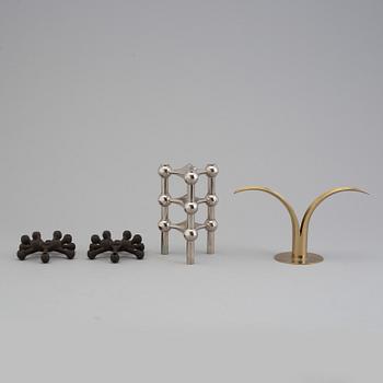4 different candlesticks, including Ystad Metall, "Nagel" by Werner Stoff.