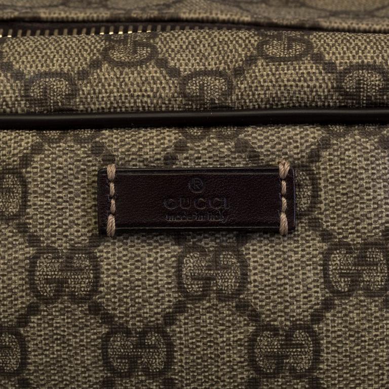GUCCI, a monogram beauty bag.