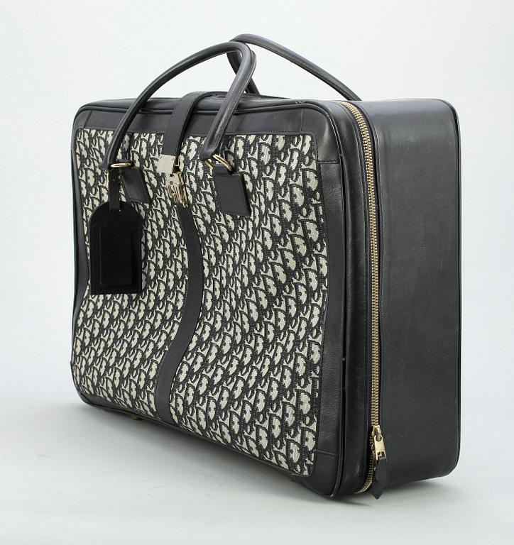 CHRISTIAN DIOR, a monogram canvas suitcase.