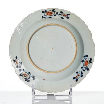 A set of three famille rose 'tobacco leaf' plates, Qing dynasty, Qianlong (1736-95).