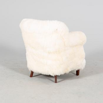 A 1940/50s cheep skin armchair.