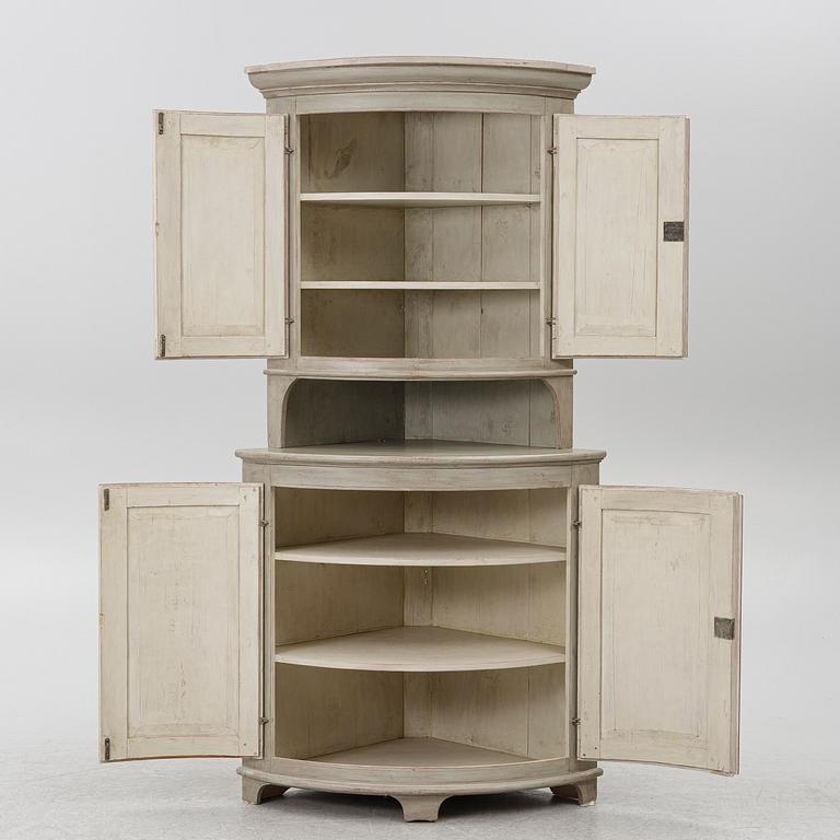A Gustavian style corner cabinet, second half of the 20th Century.