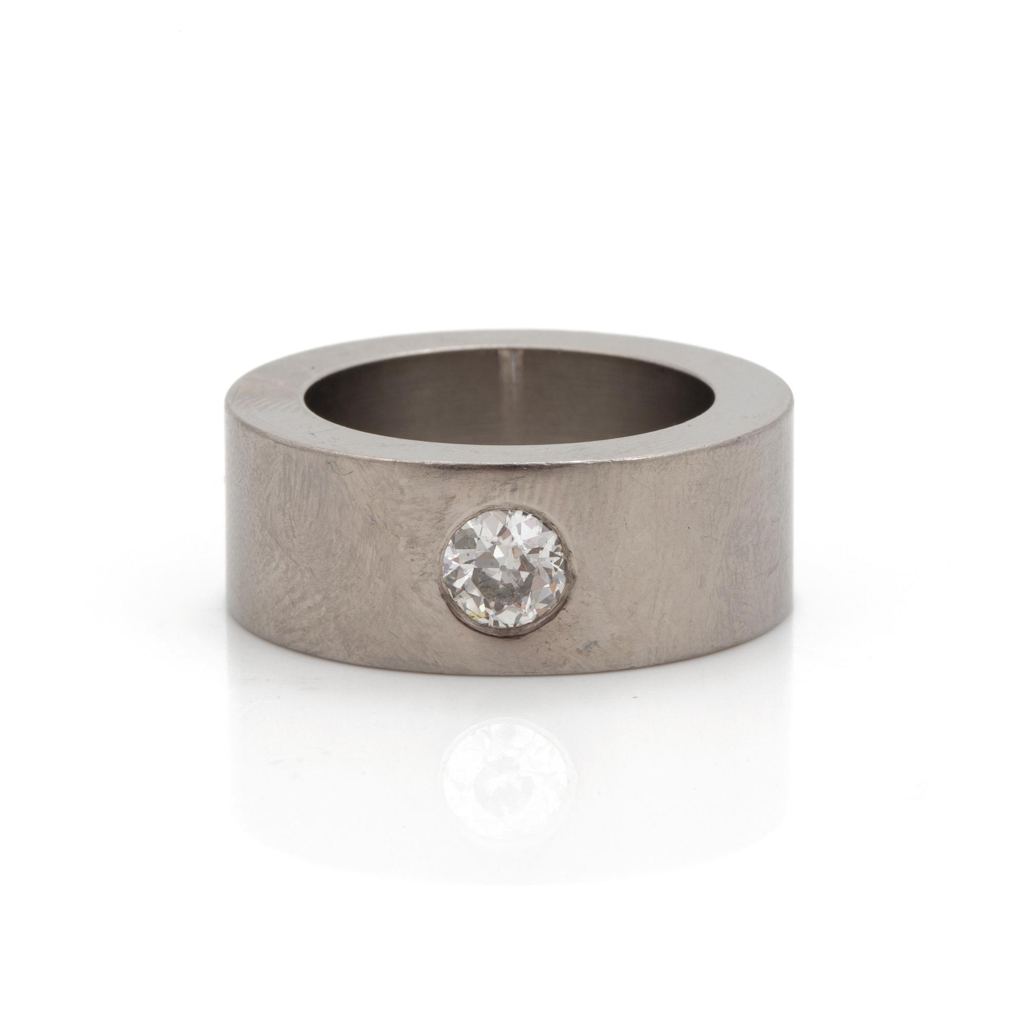 A ring set with an old-cut diamond.