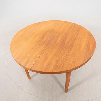 A 1960s teak dining table.