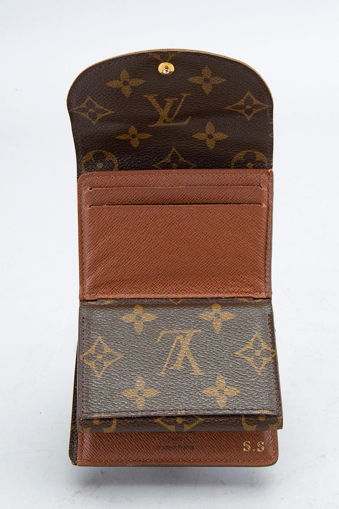 An 'Helene' wallet by Louis Vuitton.