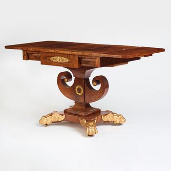 A Swedish Empire mahogany center table by Johan Öman, (Stockhom 1815-1833).