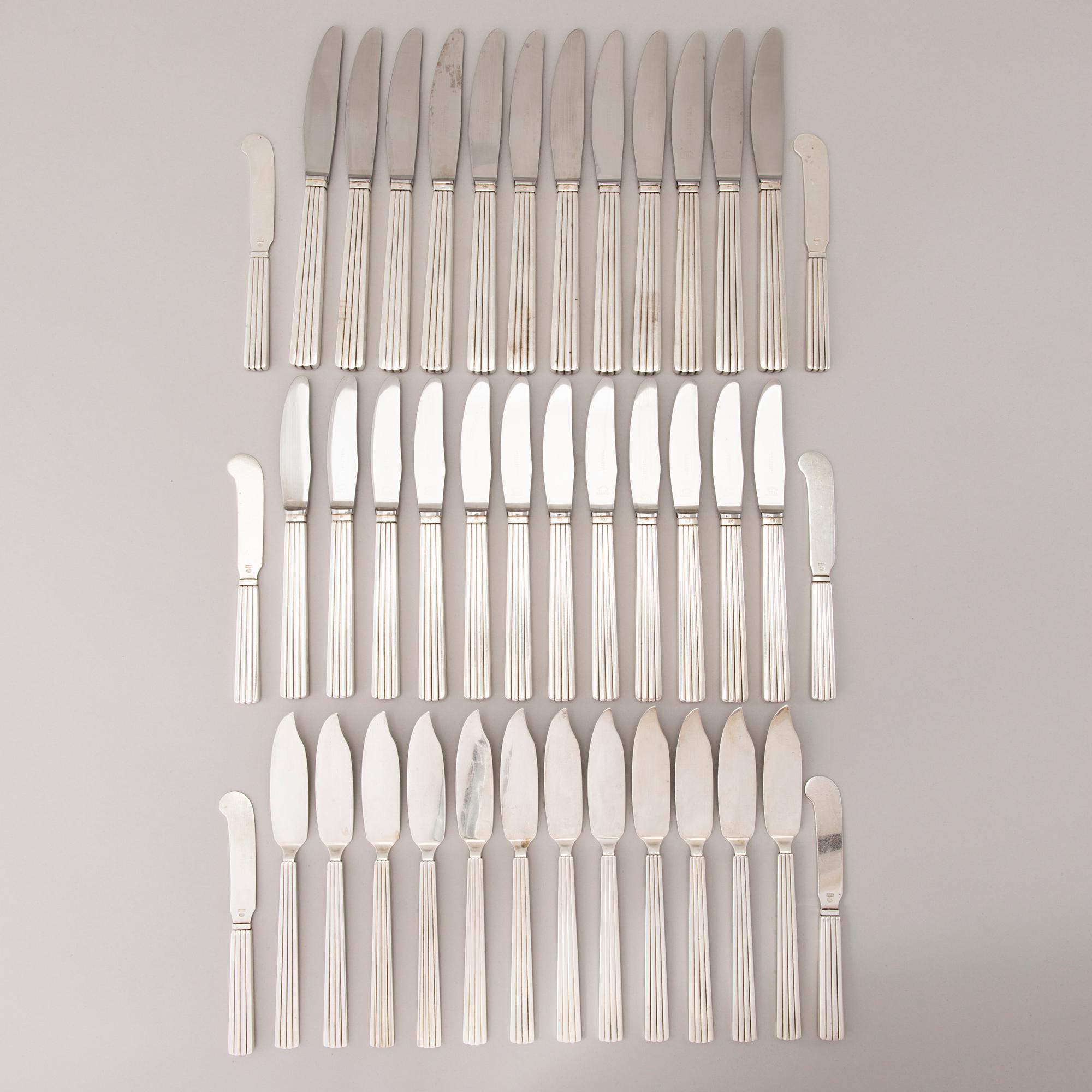 A 106 PIECE SILVER 'Bernadotte' cutlery set for George Jensen Denmark 1945-1977.