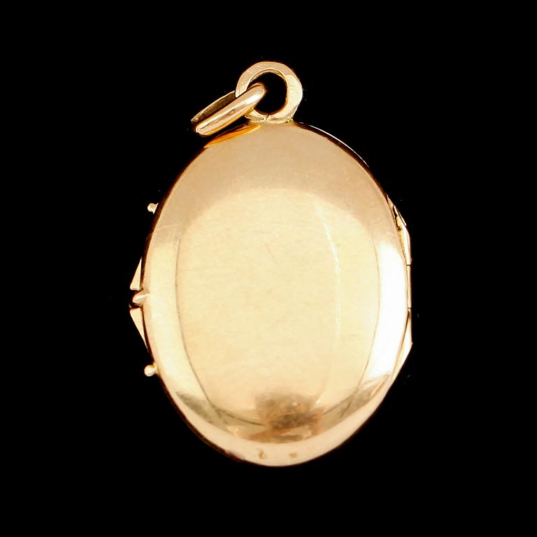 MEDALJONG, 18 k guld, omkring år 1900. Vikt ca 4 g.
