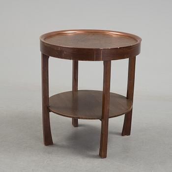 A early 20th century oak table with copper top.