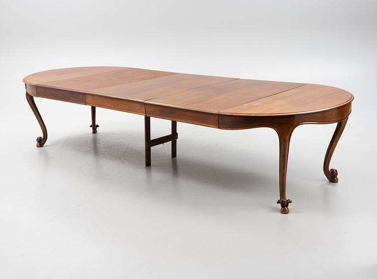 A mahogany rococo style dining table, 19th Century.