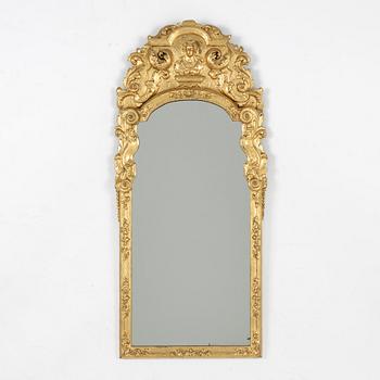 A North European late baroque giltwood mirror, first part of the 18th century.