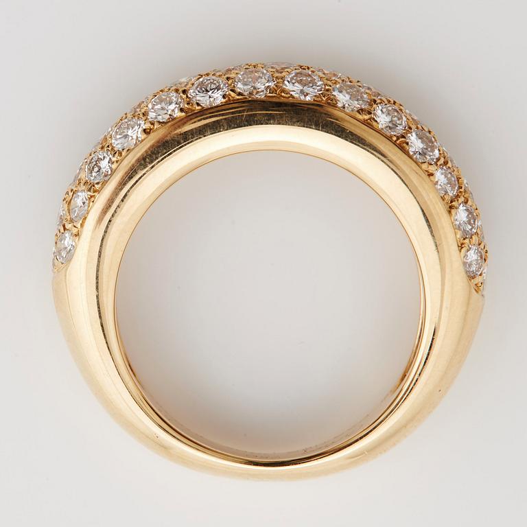 A brilliant cut diamond ring by Cartier.