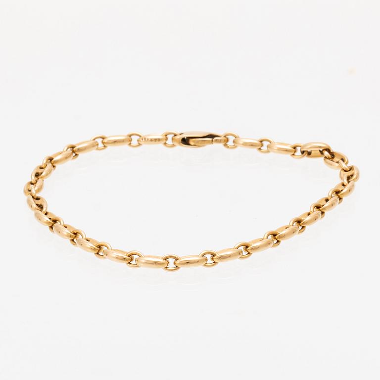An 18K gold bracelet by Cartier.
