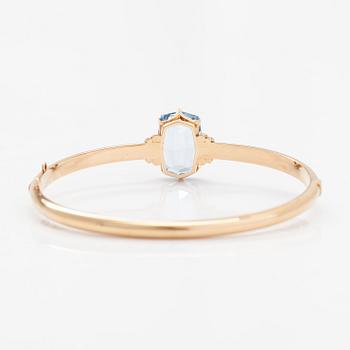 Rannekoru, 14K kultaa, synteettinen spinelli. Westerback, Helsinki 1940.