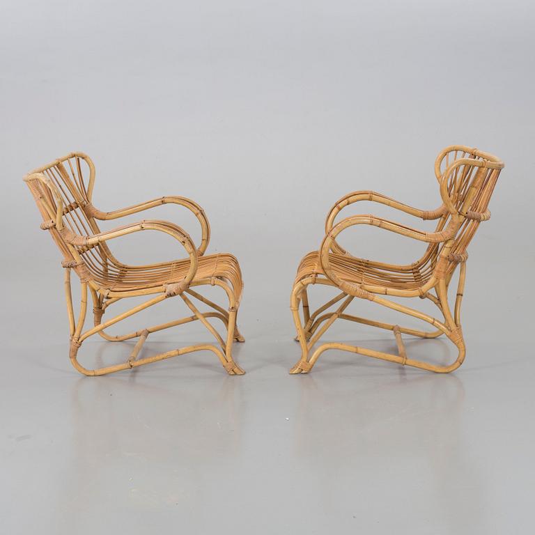 A mid 20th century ratten lounge chairs.