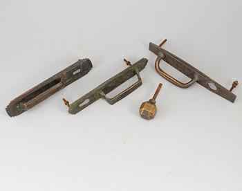 Four bronze art déco door handles, 1930s.