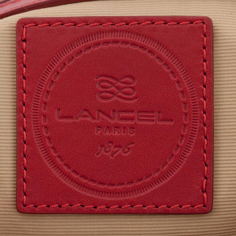 LANCEL, a red leather shoulder bag.