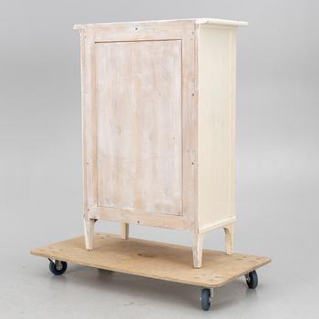 A display cabinet, early 20th century.