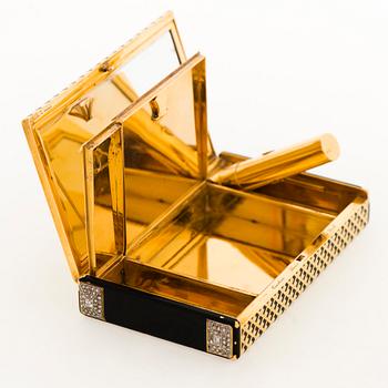 A Cartier Art Deco Vanity Case in 18K gold with enamel and baguette- and rose-cut diamonds.