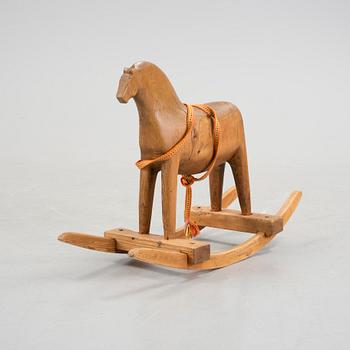 A wooden rocking horse first half of the 20th century.