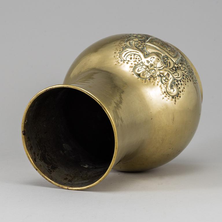 A 19th century brass champagne cooler.