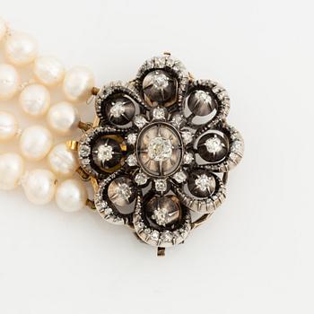 Collier/brooch, four-stranded with cultured pearls, clasp with old-cut diamonds.