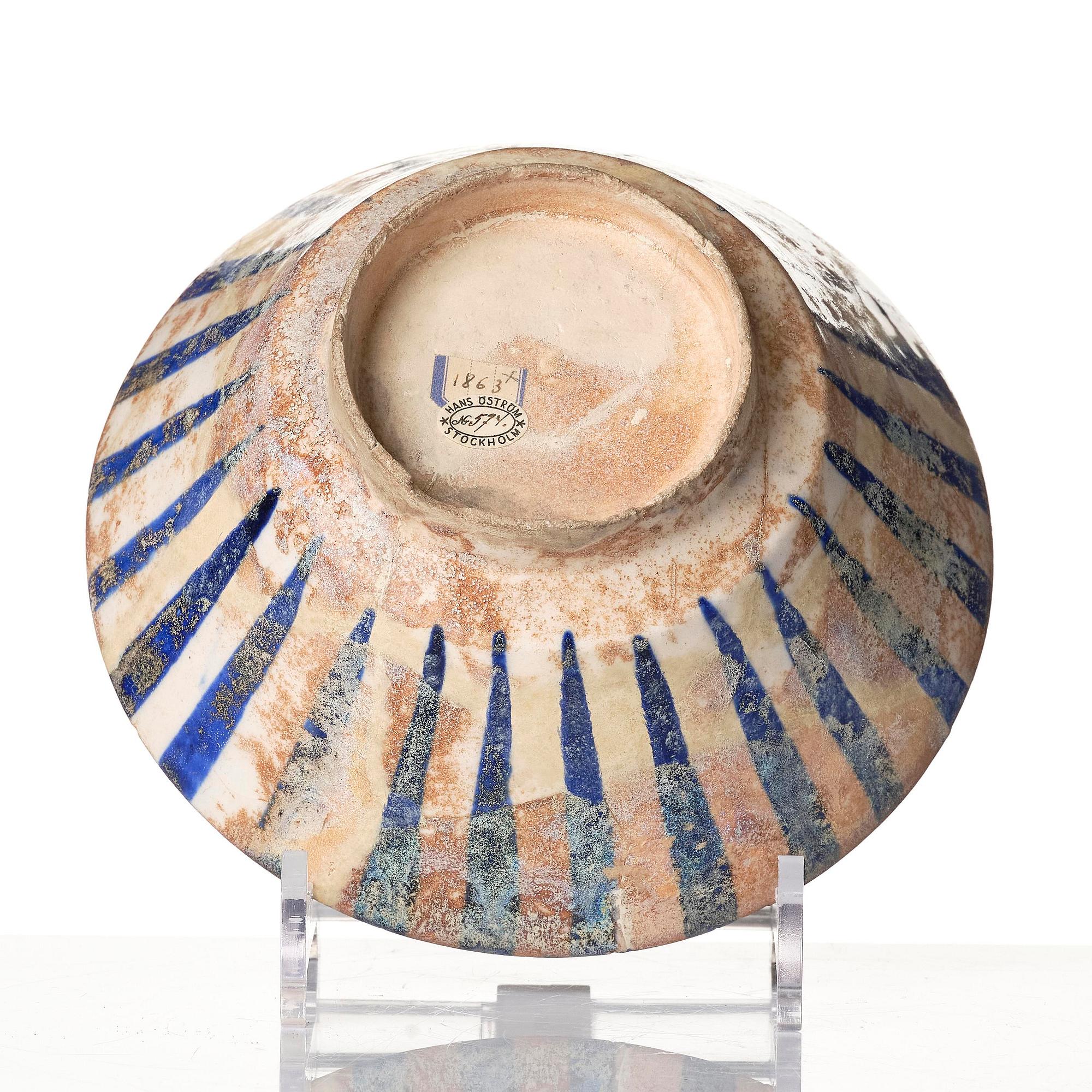 A cobalt glazed radila design pottery bowl, Persia (Iran), 12th/13th century.
