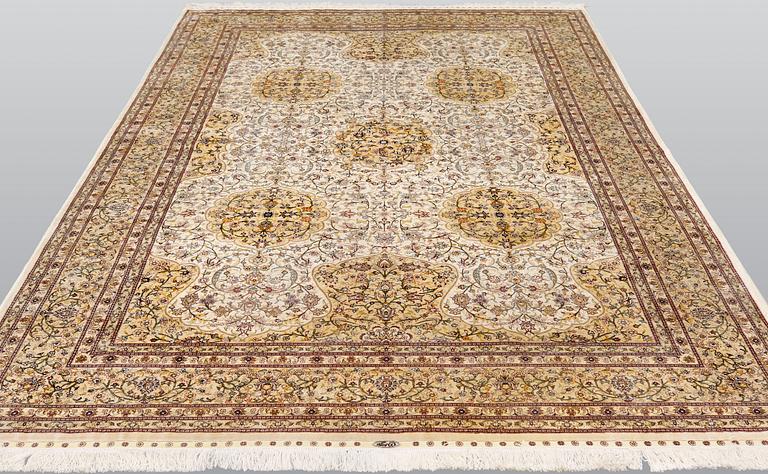 An oriental silk carpet, c. 279 x 184 cm.