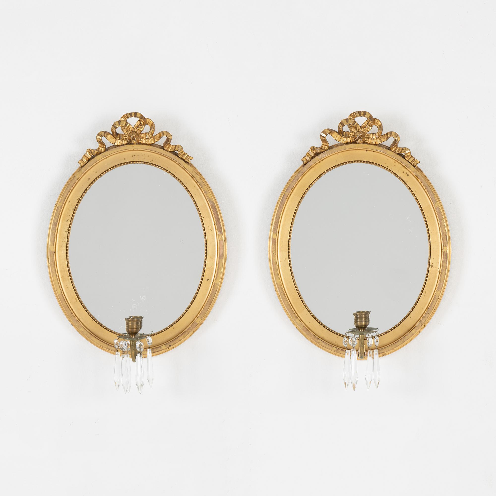A pair of gilt Gustavian style mirror wall sconces, 20th Century.