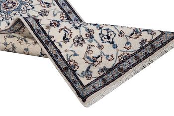 A runner carpet, Nain, part silk, 9 laa, signed, ca. 380 x 80 cm.