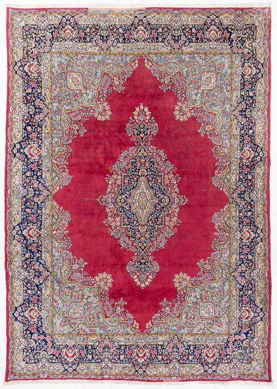 A Kirman carpet, signed, c. 388 x 279 cm.
