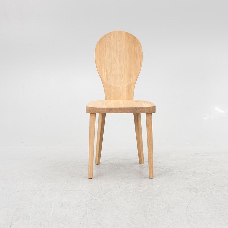 Carl Malmsten, a "skedblad" chair, Tre Sekel, Sweden, 21st century.