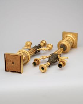 A pair of Swedish Empire early 19th century three-light candelabra.