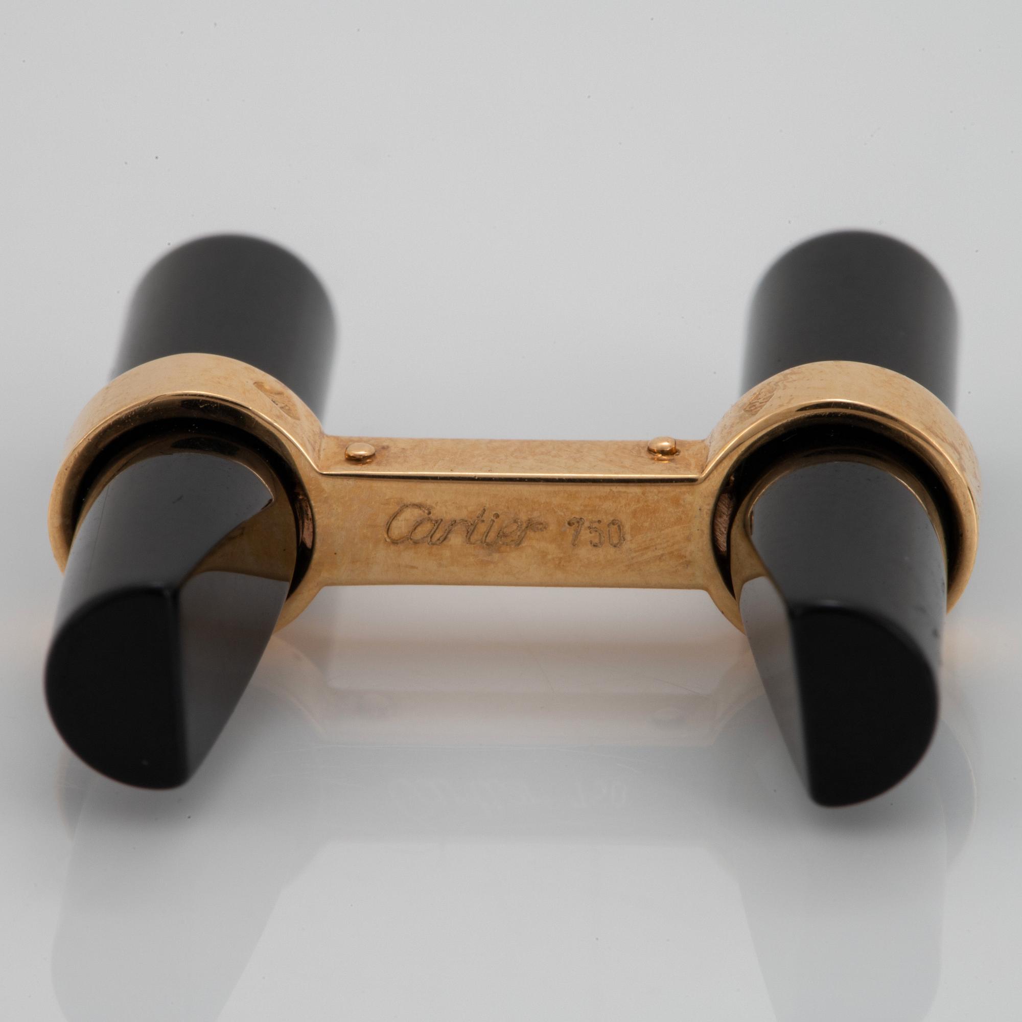 Cartier ett par manschettknappar 18K guld och onyx.