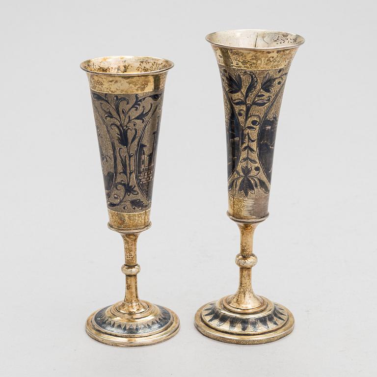 Two gilt silver and niello champagne flutes, Moscow 1842 and 1844. Unidentified maker's mark AK.