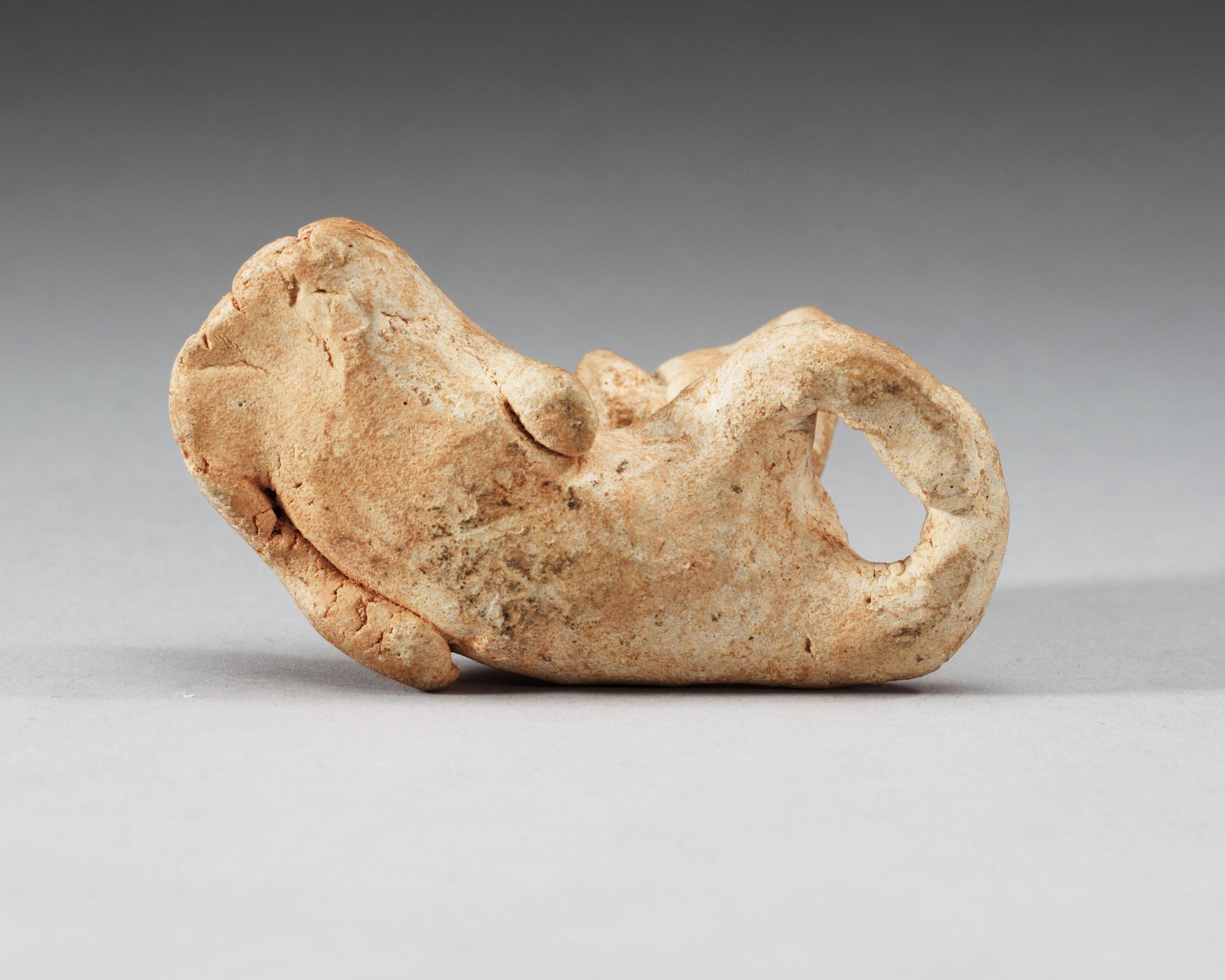 A potted figure of a dog, Six dynsties (222-589).