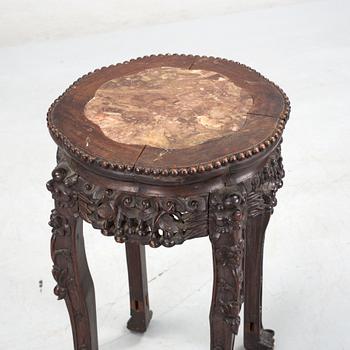 A hardwood table with marble top, China, 20th Century.