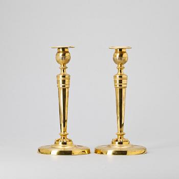 A pair of French Empire early 19th Century candlesticks.