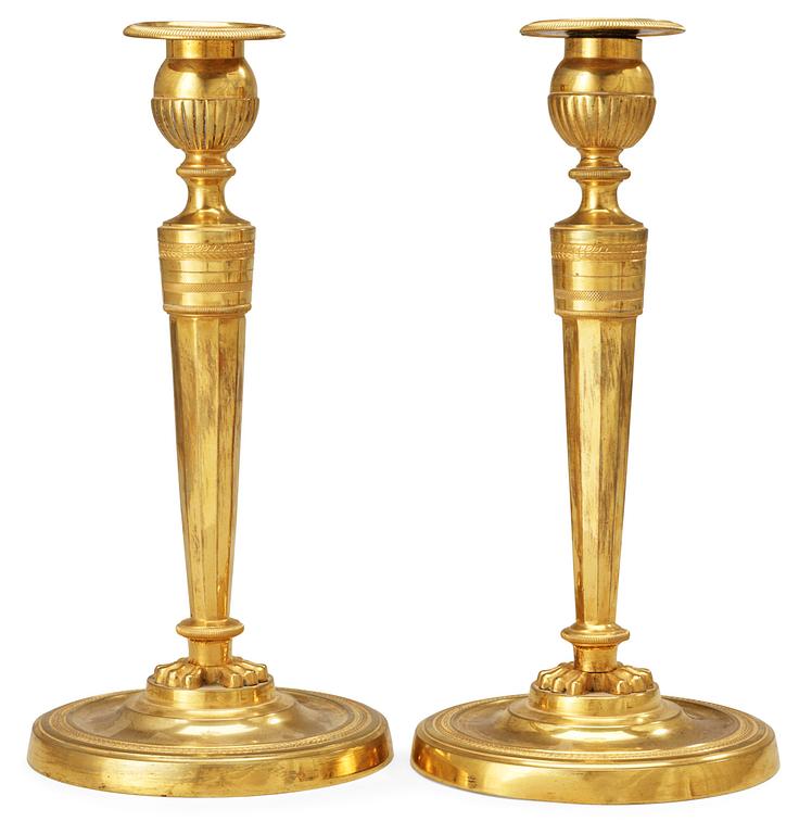 A pair of French Empire early 19th Century candlesticks.