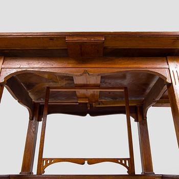 Dining table and six chairs, early 1900.