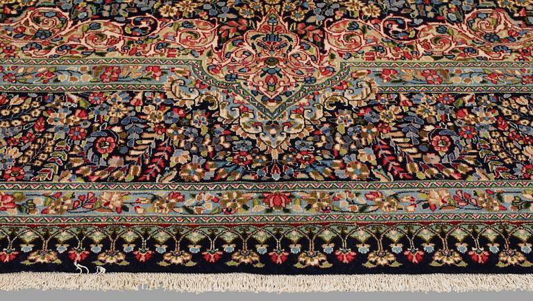 A Kirman Laver carpet, 'Millefleur', approx. 383 x 300 cm.