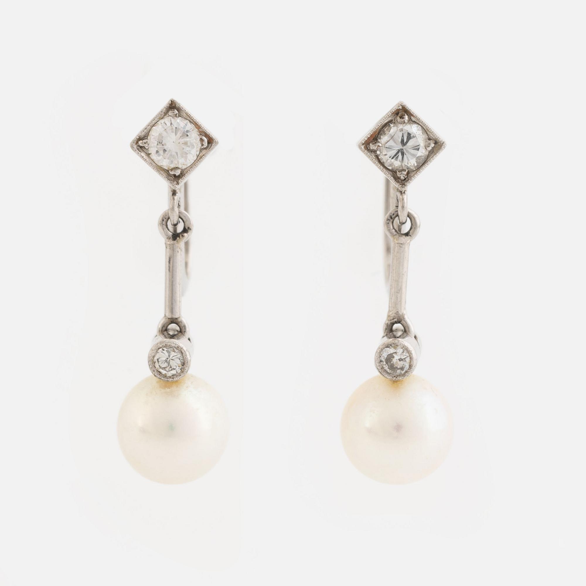 Cultured pearl and diamond earrings.