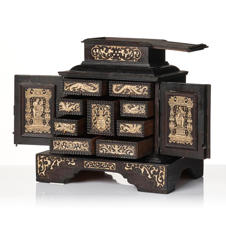 A South German, presumably Augsburg, ebony, ebonised and engraved bone inlaid table cabinet,  17th century.