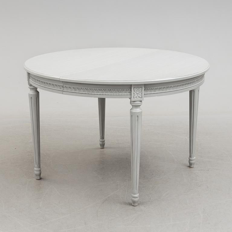 A Gustavian style dining table and ten chairs, 20th century.