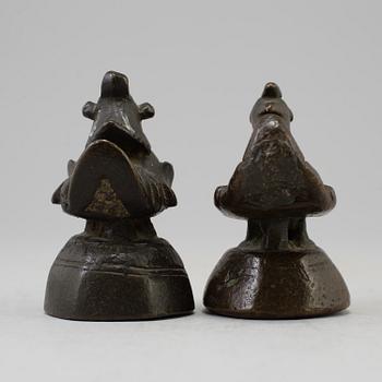 Two opium weights, Burma, circa 1900.