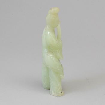 An early 20th century Chinese serpentine stone figure of an elegant lady.