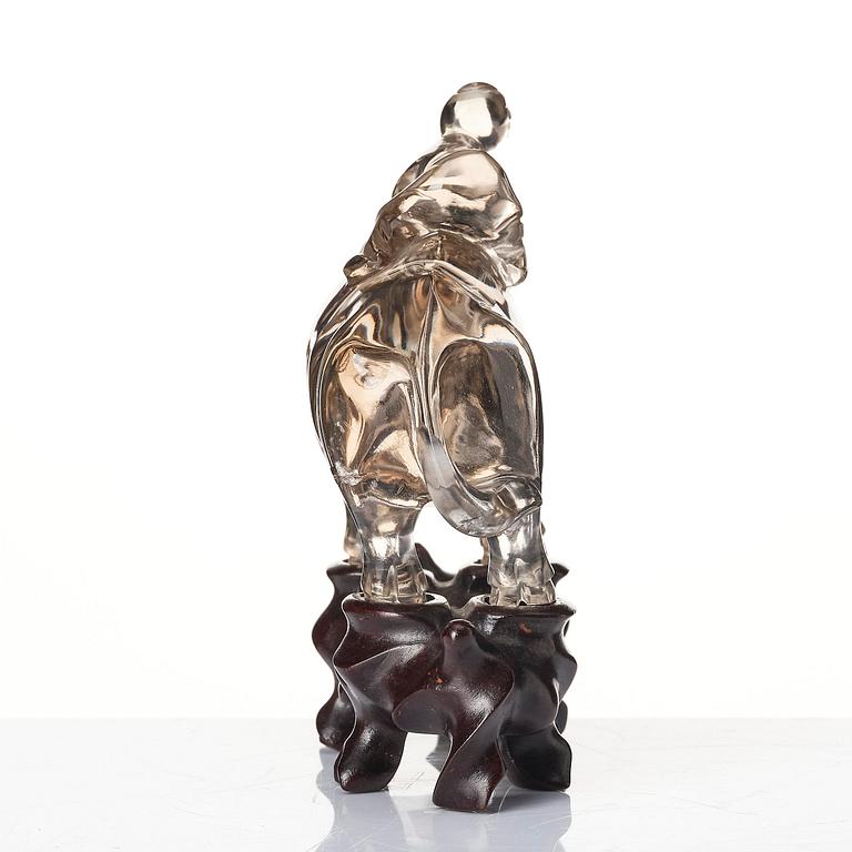 A rock chrystal sculpture of a boy on a buffalo, Qing dynasty, 19th century.