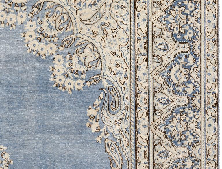 An oriental carpet, of 'vintage' design, c 343 x 244 cm.