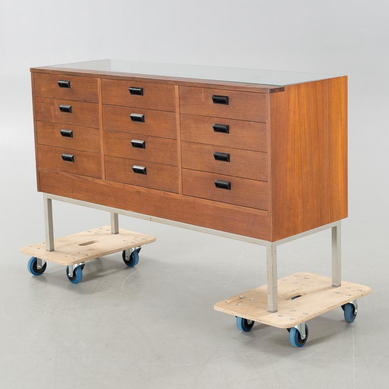 A circa mid 20th century store counter.